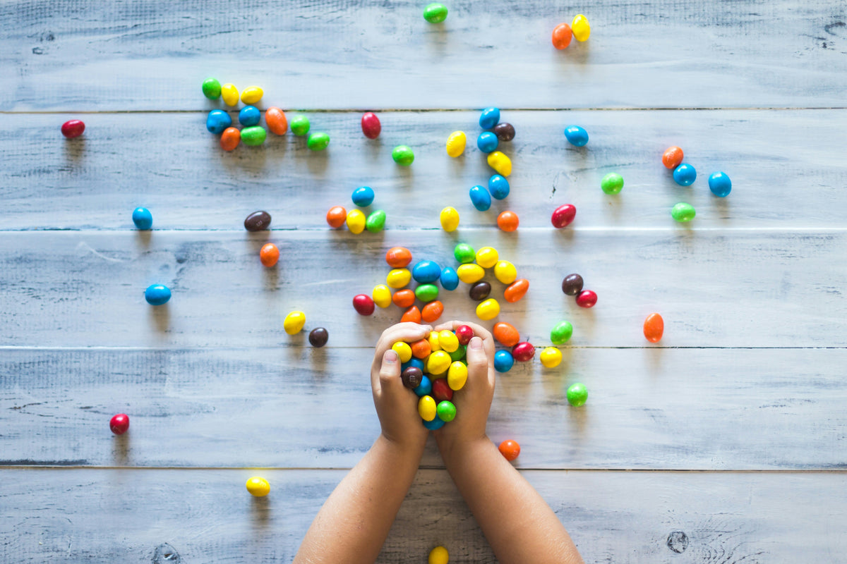 Halloween Sweets and Your Child’s Oral Microbiome: 5 Ways to Protect Their Teeth Without Banning Treats